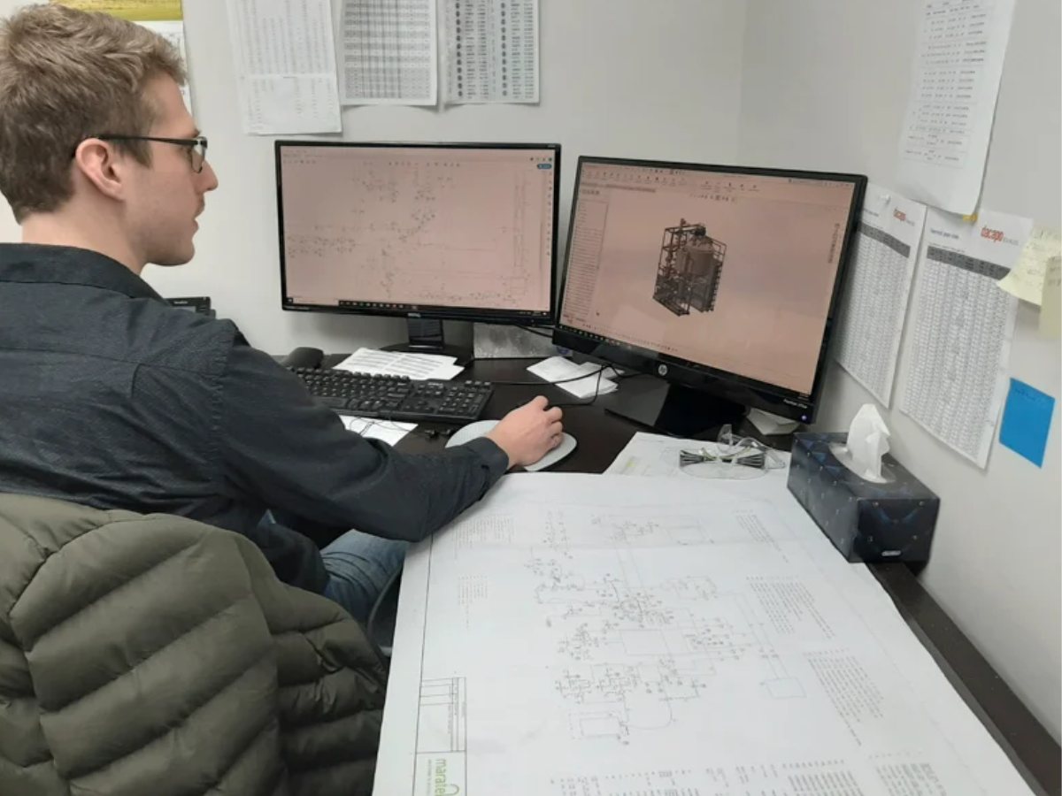 Maratek engineer designing a custom solvent recovery system in CAD