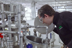 Man looking into an industrial machine